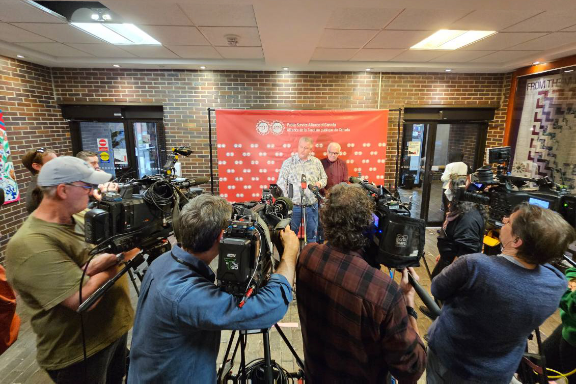 Media scrum at the PSAC Building