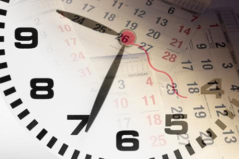 clock face superimposed on a calendar